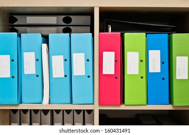 Selection Of Colorful Box Files In A Home Office