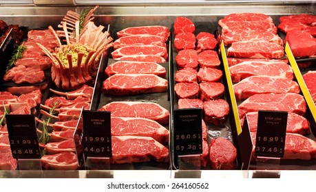 Selection of different cuts of fresh raw red meat in a supermarket