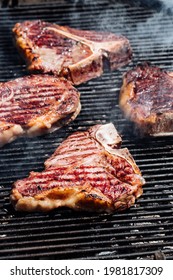 Selection Of Dry Aged Steak That Includes T Bone, Rib Eye And Rump Steak On A Barbecue