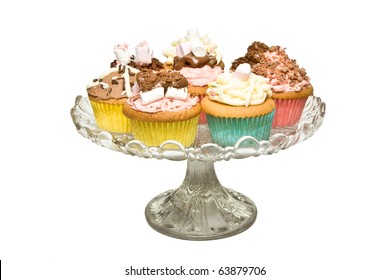 A Selection Of Fancy Homemade Cupcake On Glass Pedestal Cake Stand.