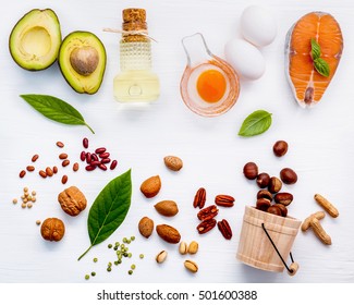 Selection food sources of omega 3 . Super food high omega 3 and unsaturated fats for healthy food. Almond ,pecan ,hazelnuts,walnuts ,olive oils ,fish oils ,salmon ,flax seeds ,chia ,eggs and avocado .