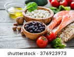 Selection of food that is good for the heart, rustic wood background