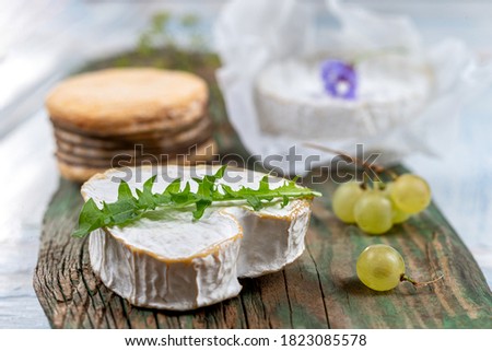 Selection of French Normandy Cheese, Camenbert, Livarot, N uchatel,white grapes