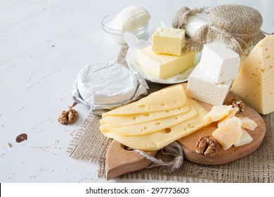 Selection Of Fresh Dairy Products - Cheese, Yogurt, Butter, White Wood Background