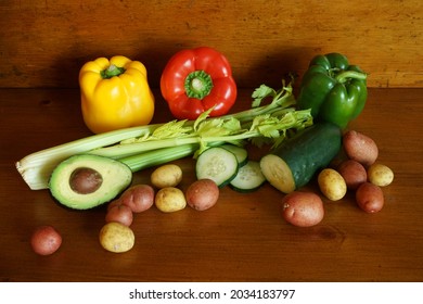 A Selection Of Fresh Vegetables On Warm Wood Surface