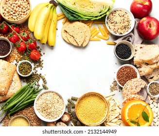 Selection Of Good Carbohydrates Sources - Vegetables, Fruits, Grains, Legumes, Nuts And Seeds On White Background, Top View.