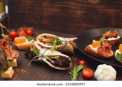 A selection of gourmet appetizers including wraps, bruschetta with prosciutto and mandarin, cherry tomatoes, and fresh herbs on a rustic table setting.
 - Powered by Shutterstock