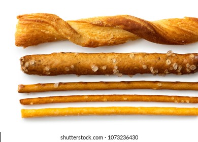 Selection Of Grissini, Pretzels And Cheese Sticks On White From Above.