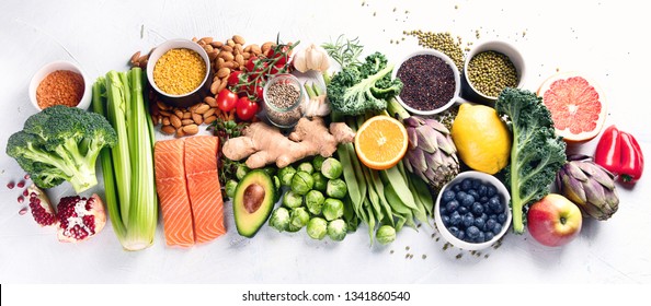 Selection Of Healthy Food. Clean Eating Concept. Cooking Ingredients With Fish, Superfood, Vegetables,  Artichokes, Brussel Sprouts, Fruits, Legumes  And Blueberries. Panorama, Banner. Top View