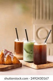selection of iced coffee and matcha drink on a coffee shop table. Minimalist concept.
