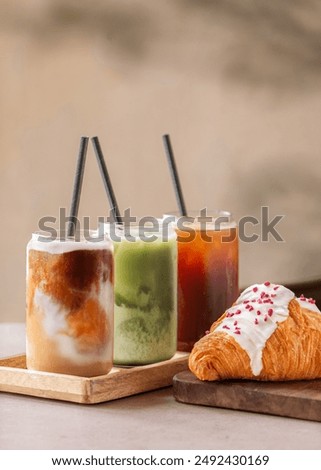 selection of iced coffee and matcha drink on a coffee shop table. Minimalist concept.