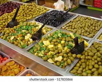 Selection of Mediterranean style pickled green and black olives for sale