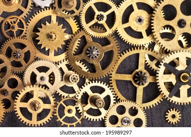 Selection of old brass clockwork cogs.