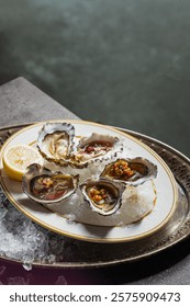 A selection of oysters on the half shell, served chilled on a bed of ice.