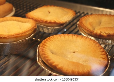 Selection Of Pies In A Chip Shop