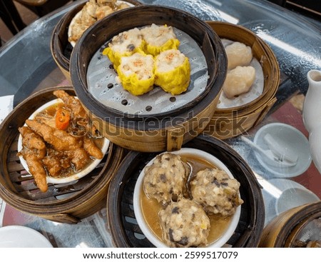 A selection of popular Cantonese Dim Sum dishes served during yum cha in a Hong Kong tea house.