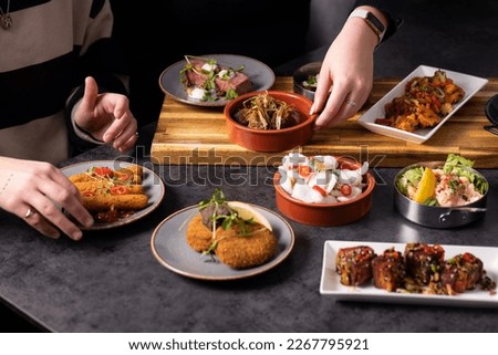 Selection of Sharing Starters Tapas and Entrees looking Tasty including Chicken, Pork and Fish