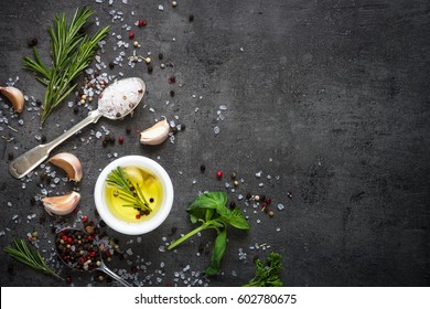 Selection Of Spices Herbs And Greens. Ingredients For Cooking. Food Background On Black Slate Table. Top View Copy Space.