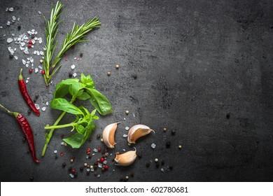Selection of spices herbs and greens. Ingredients for cooking. Food background on black slate table. Top view copy space. - Powered by Shutterstock