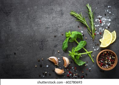 Selection Of Spices Herbs And Greens. Ingredients For Cooking. Food Background On Black Slate Table. Top View Copy Space.