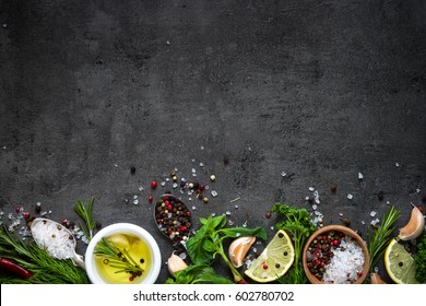 Selection Of Spices Herbs And Greens. Ingredients For Cooking. Food Background On Black Slate Table. Top View Copy Space.