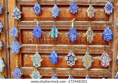 Selection of traditional Moroccan amulets, khamsa, providing defense against the evil eye, on a market in Fes