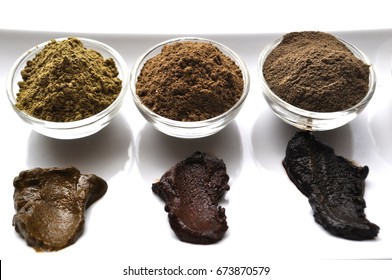 A selection of various natural henna (Lawsonia inermis) hair color dyes wet mixture isolated on white