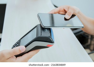 Selective Approach Of A Young Latina Girl Using Mobile Phone Contact Payment