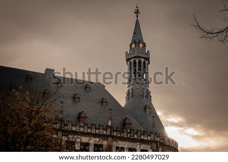 Selective blur and focus on the tower steeple of the Aachener Rathaus, the city hall of Aachen, Germany. It's a major medieval landmark of the city of Aachen.