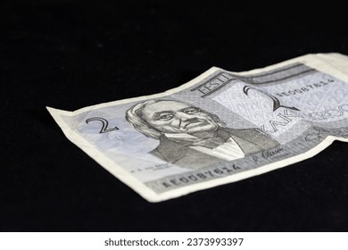 Selective blur on a banknote of 2 estonian Kroon (crown) isolated on a black background. The Kroon, or crown (EEK), was the official currency of the republic of Estonia before Euro.