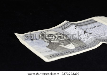 Selective blur on a banknote of 2 estonian Kroon (crown) isolated on a black background. The Kroon, or crown (EEK), was the official currency of the republic of Estonia before Euro.