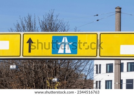 Selective blur on a german roadsign in Wuppertal, Germany, indicating directions to autobahn motorway. Such highways are known to be symbols of driving in germany and german infrastructure