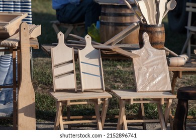 Selective blur on a mandoline displayed outdoor, wooden, artisanal. A mandoline, or mandolin, is a kitchen utensil used for cutting and slicing food with a blade. 