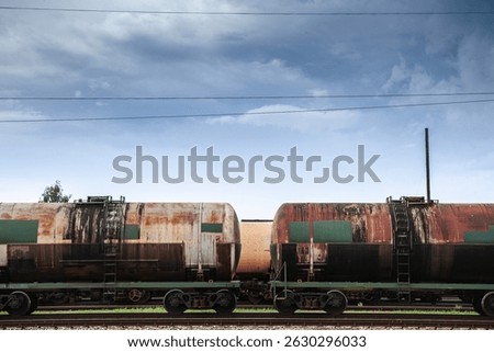 Selective blur on russian train tank cars wagons containing gas oil imported from russia, on freight yard cargo train station of Latvia in Jelgava. Energy oil imports from Russia have decreased.
