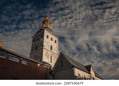 Selective blur on the steeple clocktwoer of the basilica of Saint Ursula in the afternoon. Sankt Ursula kirche is a Catholic church, a romanesque christian church of Cologne, Germany.