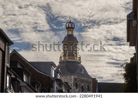 Selective blur on the steeple clocktwoer of the basilica of Saint Ursula in the afternoon. Sankt Ursula kirche is a Catholic church, a romanesque christian church of Cologne, Germany.