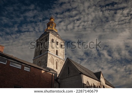 Selective blur on the steeple clocktwoer of the basilica of Saint Ursula in the afternoon. Sankt Ursula kirche is a Catholic church, a romanesque christian church of Cologne, Germany.