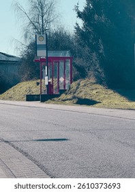 Selective blur on a typical austrian and german bus stop sign, called haltestelle, or bushaltestelle, in a graz urban environment.