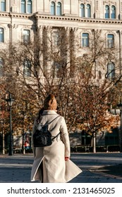 A Selective Of A Female Wearing Beige Coat, Walking In Empty Street In City Of Budapest, Hungary