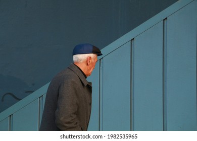 Selective Focus 04.01.2020 Istanbul Turkey: Old Man Climbing Stairs Under Galata Bridge, A Crowded Area Of ​​Eminönü