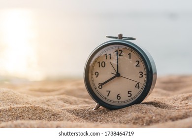 Selective Focus Of Alarm Clock On Side Table Beside Bed Show 8 O'clock In The Morning Background.Time In Life Early Bird Person Productive Concept.