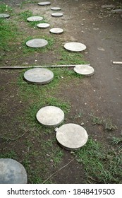 Selective Focus- Arranging Of Circle Pavers On Grassy Ground