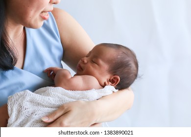 Selective Focus Asian Beautiful Young Mother Hold Newborn Baby 0-1 Month Birth With Love, Gently, Newborn Infant  Happy Sleeping In Mom Arms Bonding, Child Feeling Secure While Sleeping In Hospital