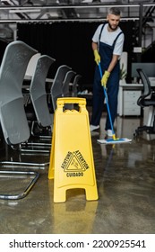 Selective Focus Of Attention Sign Board Near Cleaner Washing Floor On Blurred Background