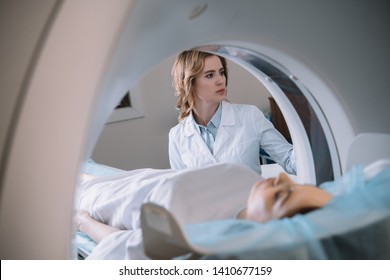 selective focus of attentive radiologist operating mri machine during patients diagnostics