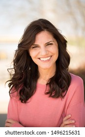 Selective Focus Of A Beautiful Mature Woman Smiling Outside