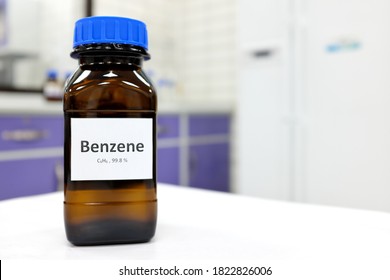 Selective Focus Of Benzene Liquid Chemical Compound In Dark Glass Bottle Inside A Chemistry Laboratory With Copy Space. Aromatic Hydrocarbon Used In Petrochemical Industry.	