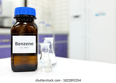 Selective Focus Of Benzene Liquid Chemical Compound In Dark Glass Bottle Inside A Chemistry Laboratory With Copy Space. Aromatic Hydrocarbon Used In Petrochemical Industry.	