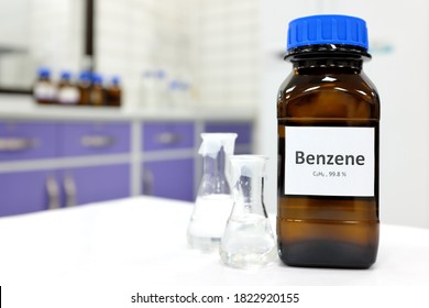 Selective Focus Of Benzene Liquid Chemical Compound In Dark Glass Bottle Inside A Chemistry Laboratory With Copy Space. Aromatic Hydrocarbon Used In Petrochemical Industry.	