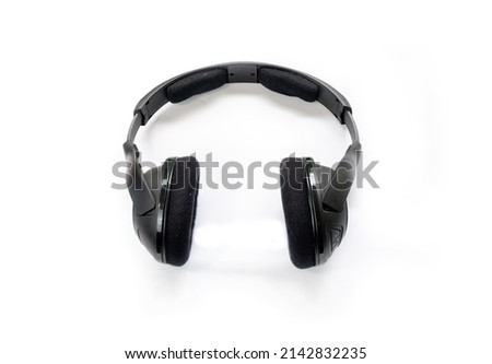 Selective focus of black headphone isolated on white background.